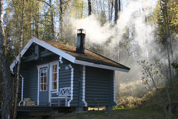 Very nicely built blue and white sauna hut in the forest Very nicely built blue and white sauna hut in the forest