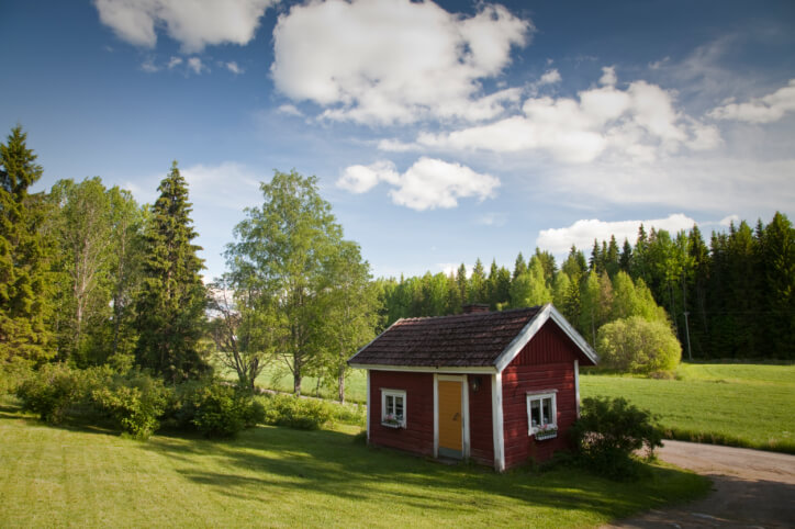 Well kept up red and white sauna house in the yard of a private home Well kept up red and white sauna house in the yard of a private home