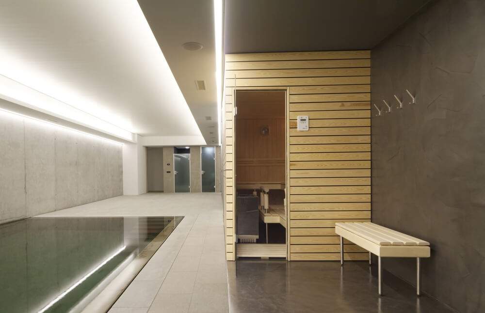 Exterior of a small sauna in private residence in the indoor pool area. Exterior of a small sauna in private residence in the indoor pool area.