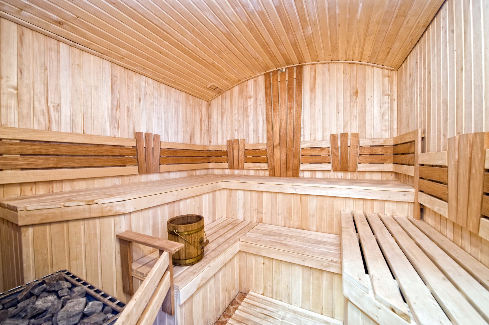 Staggered tiered sauna interior with arched roof Staggered tiered sauna interior with arched roof