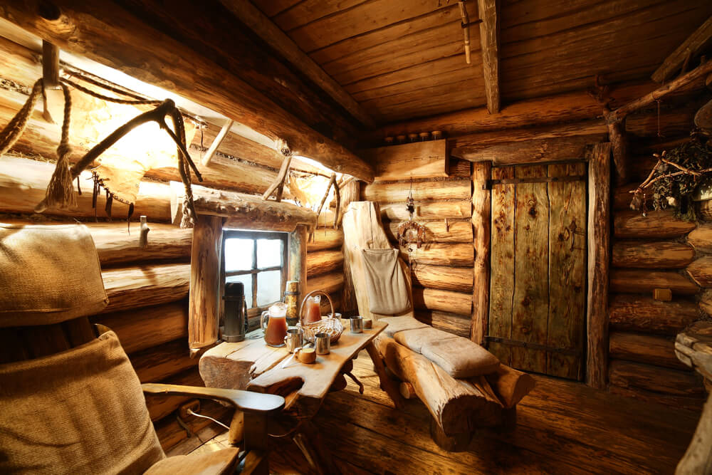 Close up of traditional sauna chairs made from logs with canvas bags on top for padding. Close up of traditional sauna chairs made from logs with canvas bags on top for padding.