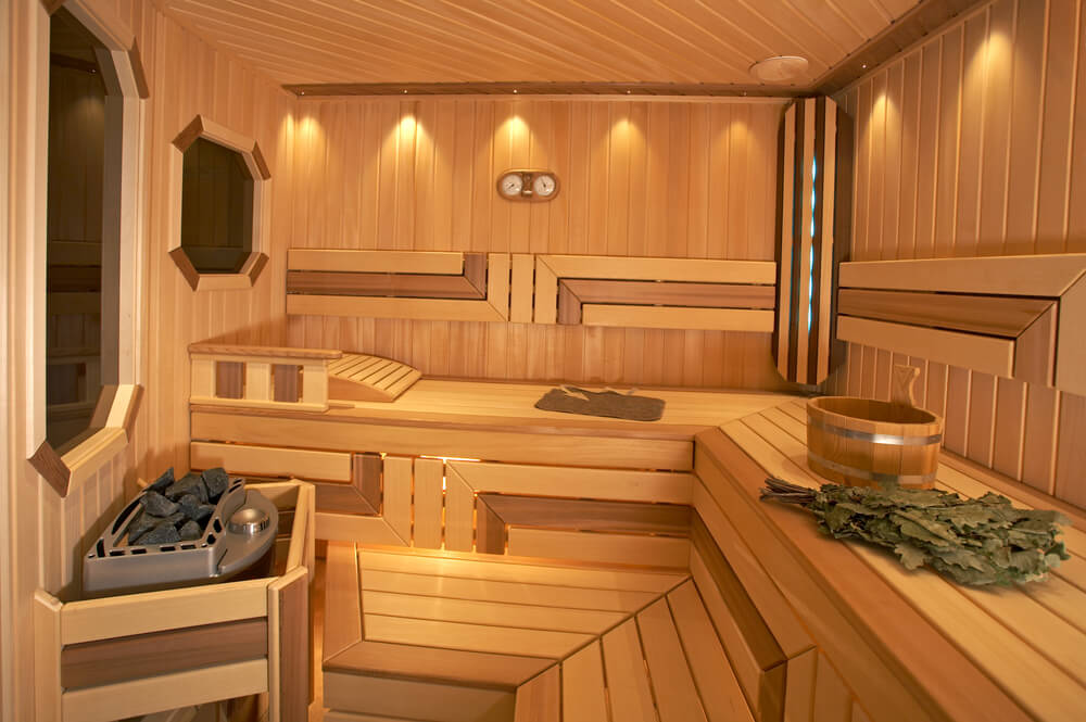 New sauna with L-shape using two tones of wood for a more intricate interior sauna design. New sauna with L-shape using two tones of wood for a more intricate interior sauna design.