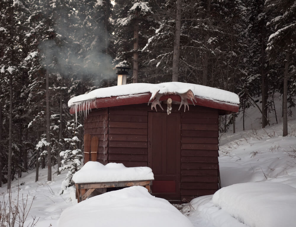 Small wood sauna hut in the snow Small wood sauna hut in the snow