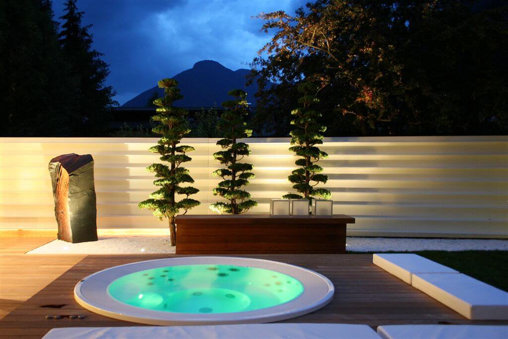 Jacuzzi area featuring rock garden and Japanese-style seating around. Jacuzzi area featuring rock garden and Japanese-style seating around.