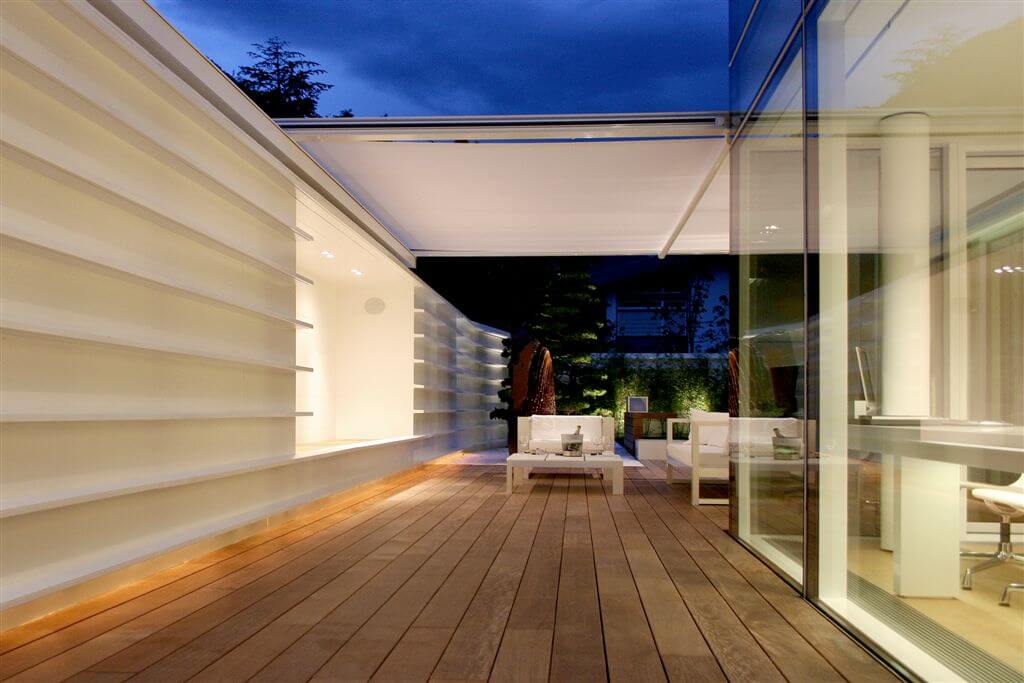 View at night highlighting extended canopy, lit-up shelf seating area, and view indoors. View at night highlighting extended canopy, lit-up shelf seating area, and view indoors.