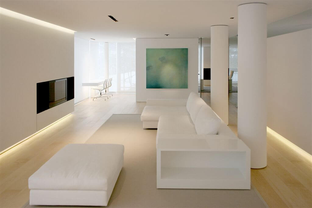 Here is a second angle on the living room, highlighting the large white pillars and white couch and ottoman set. Here is a second angle on the living room, highlighting the large white pillars and white couch and ottoman set.