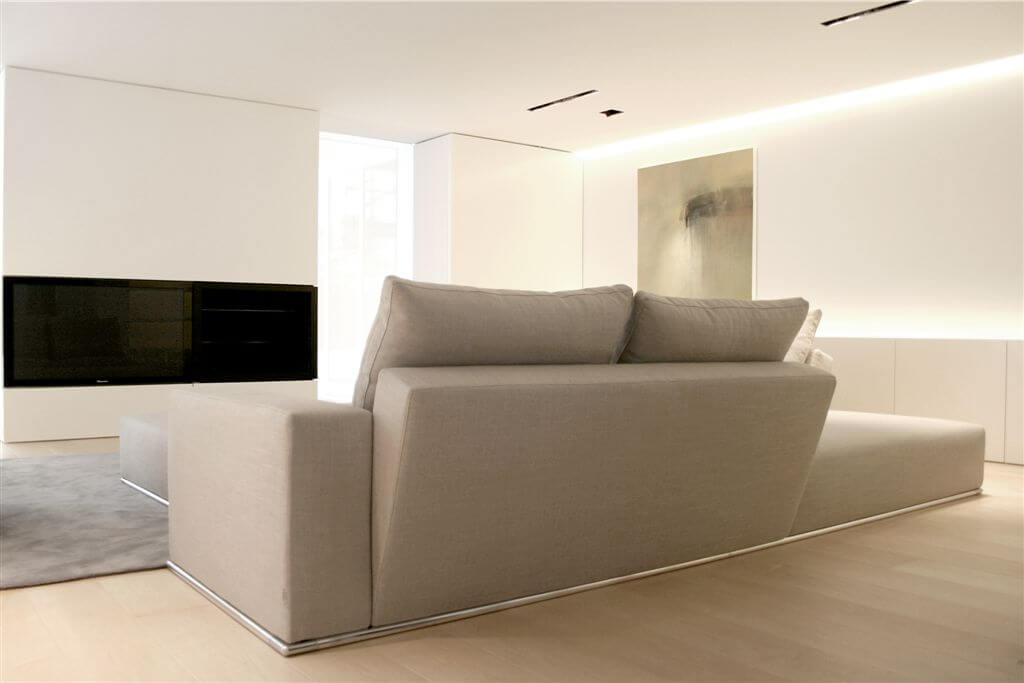 Here's a second living room with unique couch/ottoman furniture and wall-embedded light sources. Here's a second living room with unique couch/ottoman furniture and wall-embedded light sources.