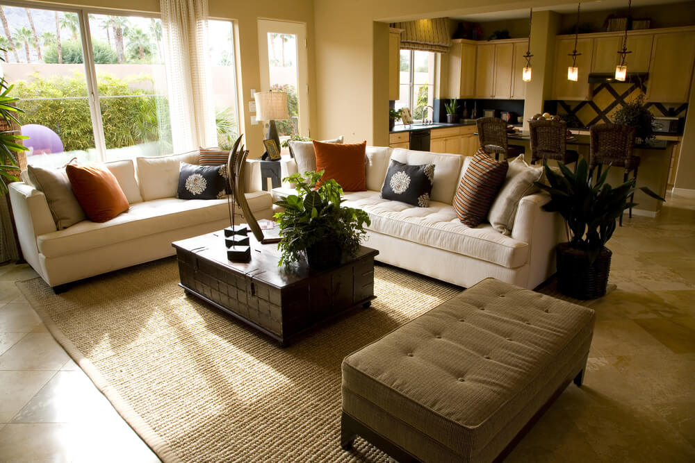 This living room design demonstrates an interesting tip and that's the separate ottoman which can serve as a feet rest or second coffee table. This living room design demonstrates an interesting tip and that's the separate ottoman which can serve as a feet rest or second coffee table.