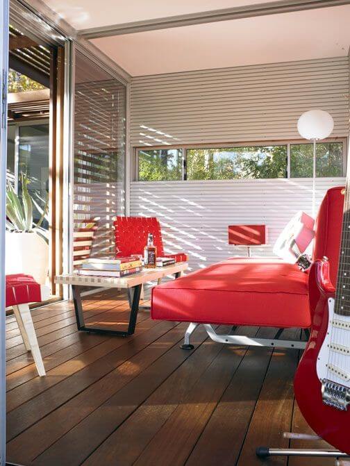 This module is designed for relaxation, with large red futon, wood and metal coffee table, and matching red furniture throughout. This module is designed for relaxation, with large red futon, wood and metal coffee table, and matching red furniture throughout.