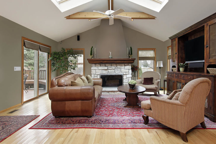 A slight arched vault in this living room is coupled with skylights and a few exposed beams to give height and natural light to this otherwise slightly dark living room. A slight arched vault in this living room is coupled with skylights and a few exposed beams to give height and natural light to this otherwise slightly dark living room.