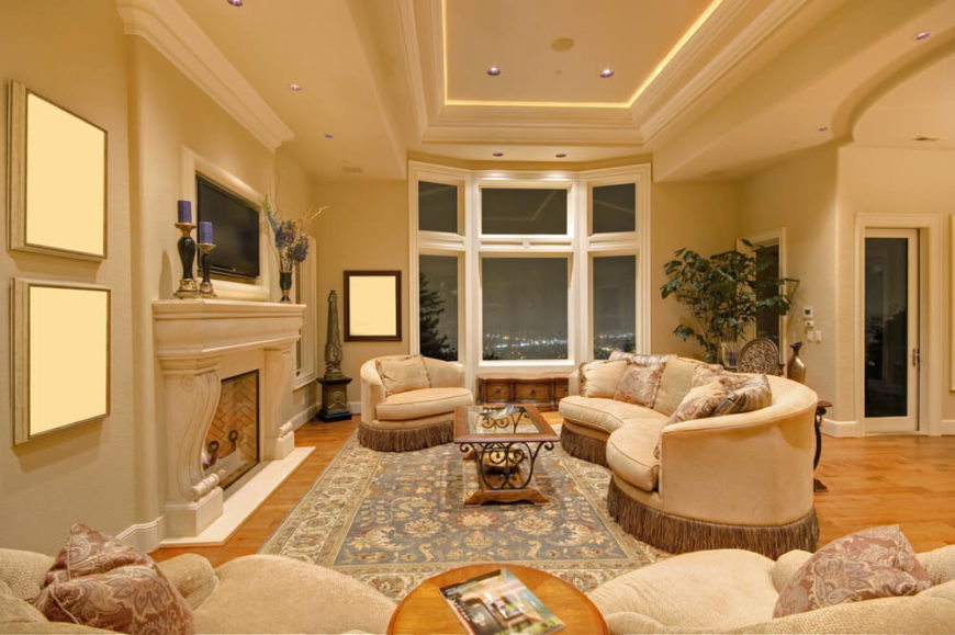 This elegant living room may not have a skylight, but additional rope lighting was placed inside the tray ceiling to add a gentle illumination to the room. This elegant living room may not have a skylight, but additional rope lighting was placed inside the tray ceiling to add a gentle illumination to the room.