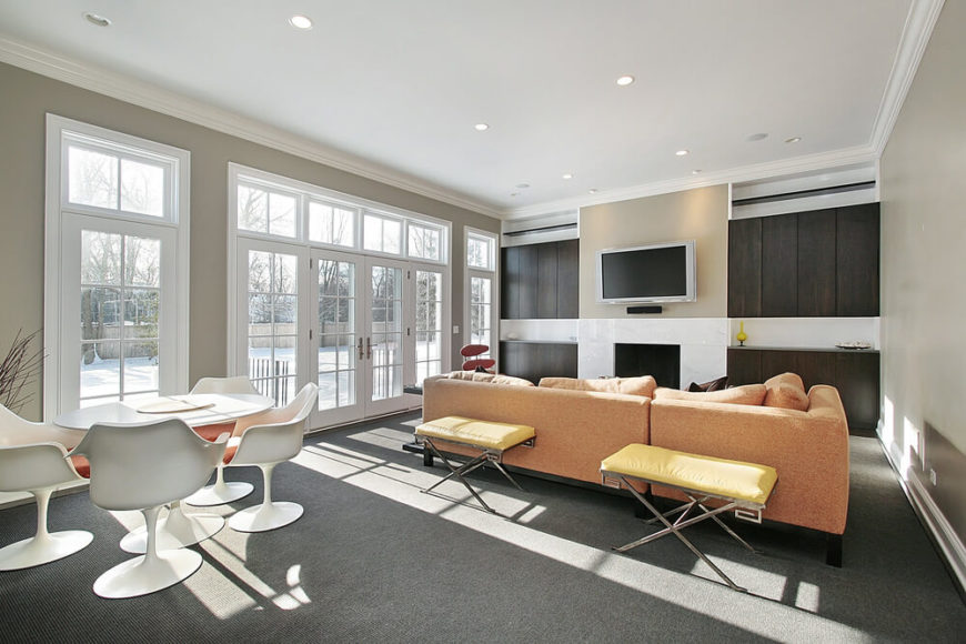 This is a great example of low pile carpet, which doesn't attract as much dust and hair, but still keeps the warmth. This deep charcoal color is the perfect accompaniment to the light beige walls, white dining table, and pale orange sofa. This is a great example of low pile carpet, which doesn't attract as much dust and hair, but still keeps the warmth. This deep charcoal color is the perfect accompaniment to the light beige walls, white dining table, and pale orange sofa.