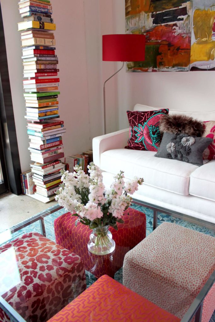 If you like the look of an ottoman but also need a traditional coffee table, this is a great way to have the best of both worlds. Each of the four ottomans can be pulled out for extra seating and then put back under the coffee table so that they're stored out of the way. If you like the look of an ottoman but also need a traditional coffee table, this is a great way to have the best of both worlds. Each of the four ottomans can be pulled out for extra seating and then put back under the coffee table so that they're stored out of the way.