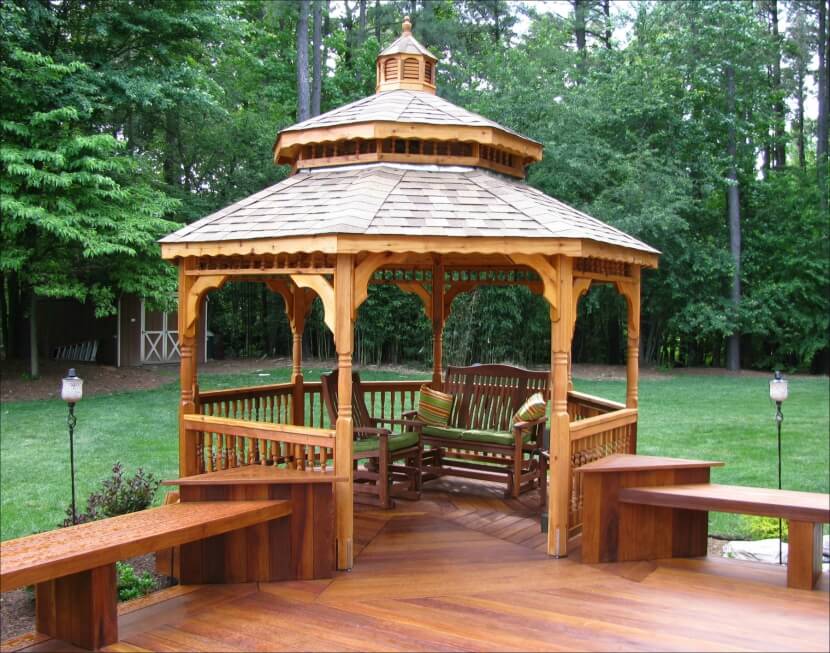 This cedar gazebo is attached to the side of a deck and overlooks the wooded backyard, including a shed tucked into the trees. This cedar gazebo is attached to the side of a deck and overlooks the wooded backyard, including a shed tucked into the trees.