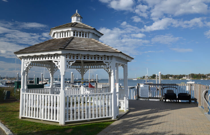 Ornate details on a gazebo are perfect for dressing up a yard. This one has craftsman style details, and adds a bit of elegance to this marina. Ornate details on a gazebo are perfect for dressing up a yard. This one has craftsman style details, and adds a bit of elegance to this marina.