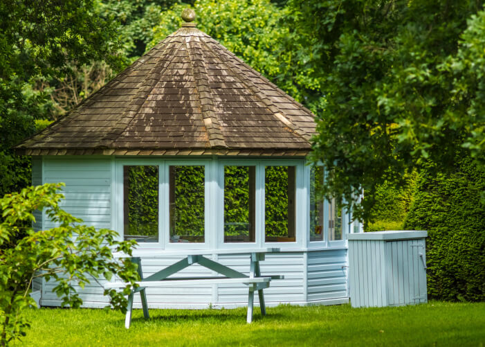 This pretty blue gazebo is fully enclosed and has a matching blue picnic table outside. This pretty blue gazebo is fully enclosed and has a matching blue picnic table outside.