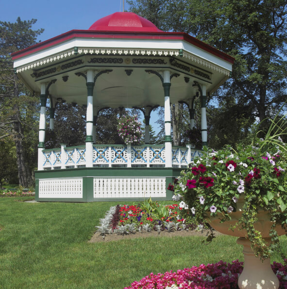 A colorful gazebo that is large enough to be used as a bandstand. The surrounding landscape is color matched to the paint job on the gazebo. A colorful gazebo that is large enough to be used as a bandstand. The surrounding landscape is color matched to the paint job on the gazebo.