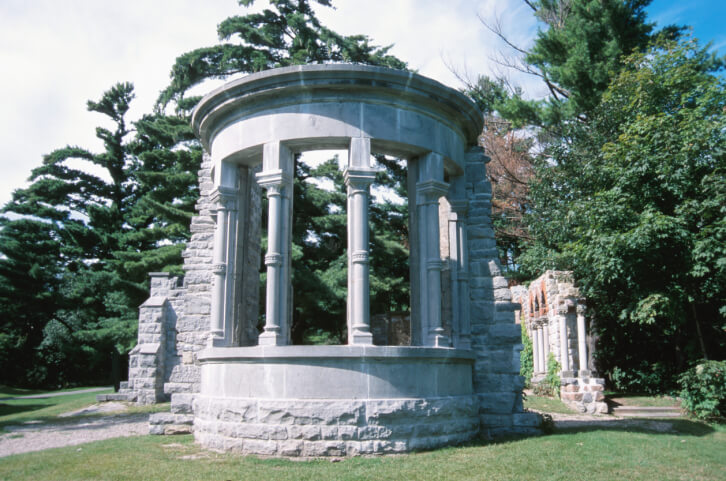 This is an incredible example of a round gazebo made out of sculpted concrete and stone. It has a decidedly majestic and imposing footprint. This is an incredible example of a round gazebo made out of sculpted concrete and stone. It has a decidedly majestic and imposing footprint.