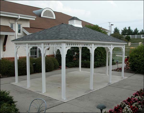 An open pavilion-style gazebo behind the house on a concrete patio. Add some furniture and you'll have a great space to dine outside. An open pavilion-style gazebo behind the house on a concrete patio. Add some furniture and you'll have a great space to dine outside.