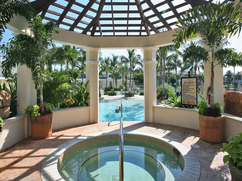 81z-gazebo-hottub Seen from inside the gazebo, we can see a circular hot tub that looks out onto a large pool area. The container gardens surrounding the area help make it feel more private 81z-gazebo-hottub Seen from inside the gazebo, we can see a circular hot tub that looks out onto a large pool area. The container gardens surrounding the area help make it feel more private