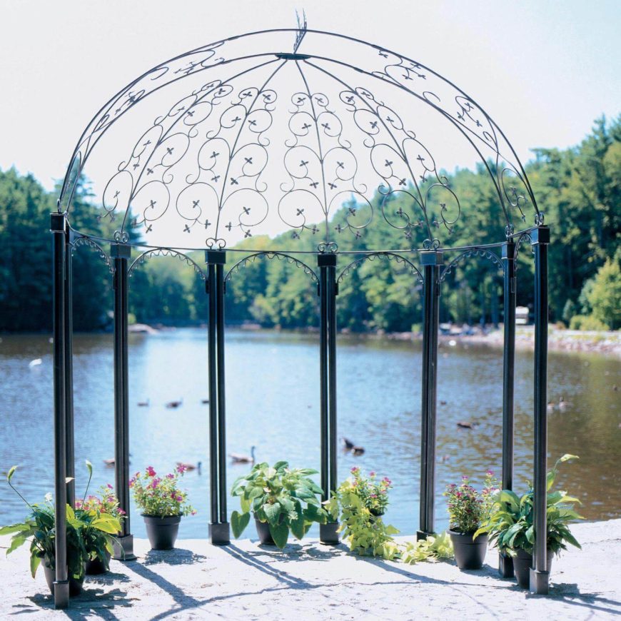 This is a simple, barebones metal gazebo on the edge of a small lake. The area is spruced up with a few small planters. This is a simple, barebones metal gazebo on the edge of a small lake. The area is spruced up with a few small planters.