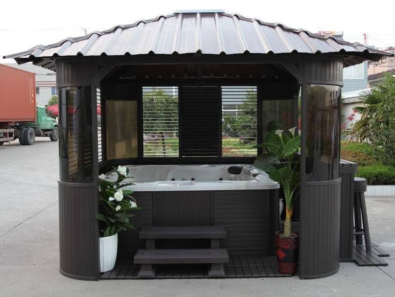 This portable hot tub gazebo features a riveted roof, tinted glass windows, and enough extra space to add some plants or shelving for towels. This portable hot tub gazebo features a riveted roof, tinted glass windows, and enough extra space to add some plants or shelving for towels.