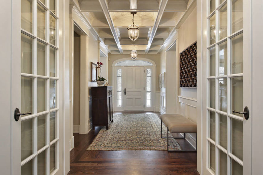 Moderately sized one-story foyer in white designed in a hallway layout leading to various rooms of the home. Moderately sized one-story foyer in white designed in a hallway layout leading to various rooms of the home.