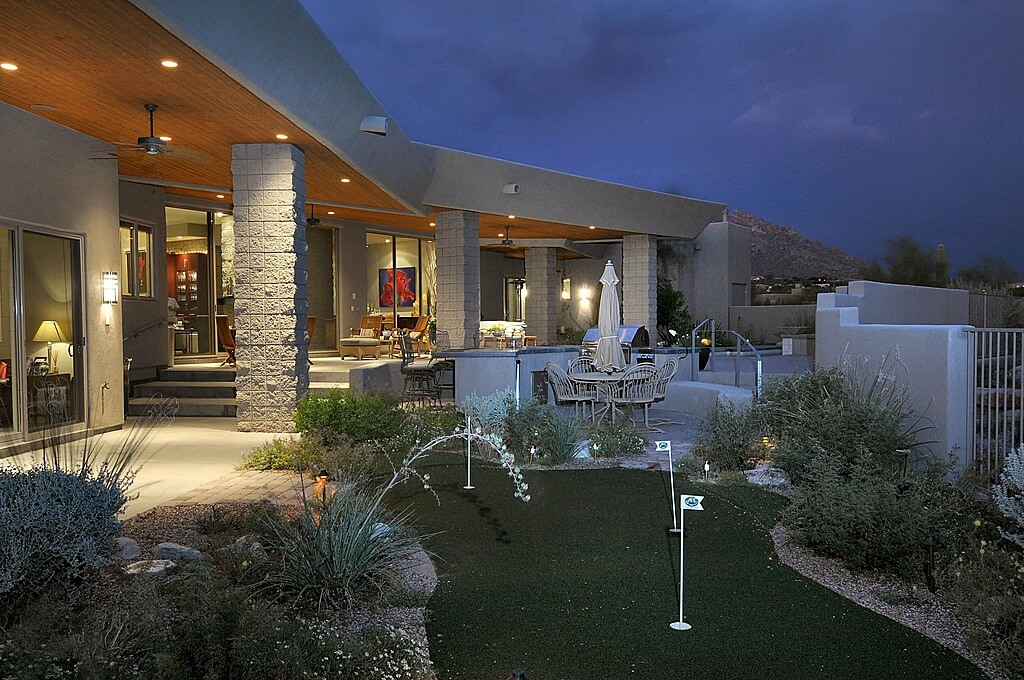 Compact custom artificial green embedded in Southwest style garden, steps away from expansive outdoor seating space of this thoroughly modern home. Compact custom artificial green embedded in Southwest style garden, steps away from expansive outdoor seating space of this thoroughly modern home.