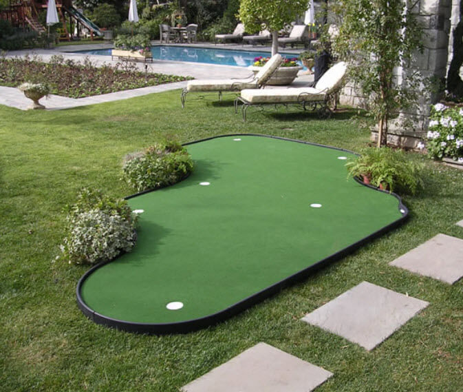 This prefabricated green is crafted from nylon panels, allowing for myriad configurations indoors or out. This poolside example features multiple holes and plant accents. This prefabricated green is crafted from nylon panels, allowing for myriad configurations indoors or out. This poolside example features multiple holes and plant accents.