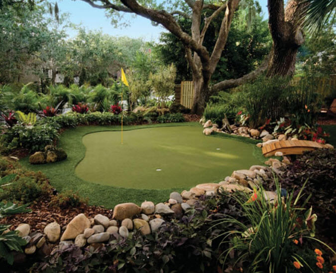 This custom green is wrapped with a lush tropical garden, protected by sprawling trees, and accessed by a small natural wood foot bridge. This custom green is wrapped with a lush tropical garden, protected by sprawling trees, and accessed by a small natural wood foot bridge.
