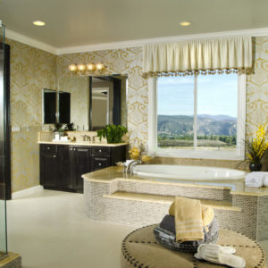 Luxury primary bathroom with large soaking tub in the center