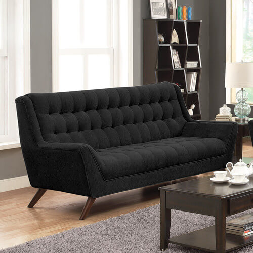 This mid-century modern black sofa has tufted seating and padded armrests. The upholstery is an attractive chenille fabric. A deep expresso finish on the wood legs adds another flair of style to the elegant sofa. This mid-century modern black sofa has tufted seating and padded armrests. The upholstery is an attractive chenille fabric. A deep expresso finish on the wood legs adds another flair of style to the elegant sofa.