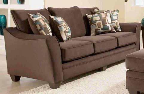 This contemporary sofa in expresso flannel includes accent pillows. The curved armrests add contemporary flair. This contemporary sofa in expresso flannel includes accent pillows. The curved armrests add contemporary flair.