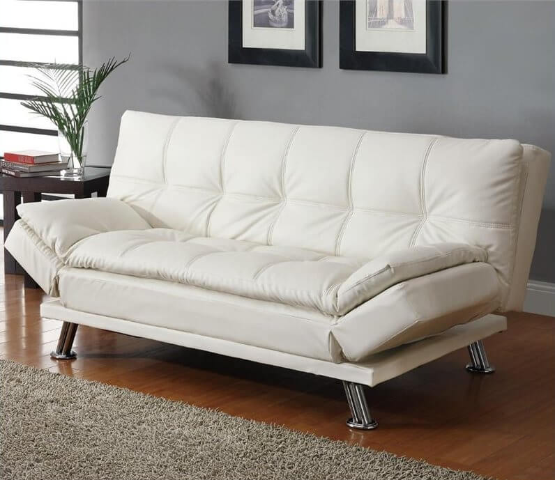 This contemporary white convertible sofa has plush pillow-top cushions to sink into and relax. The extra comfort comes in handy, as this sofa doubles as a futon when the backrest and armrests are folded down. This contemporary white convertible sofa has plush pillow-top cushions to sink into and relax. The extra comfort comes in handy, as this sofa doubles as a futon when the backrest and armrests are folded down.