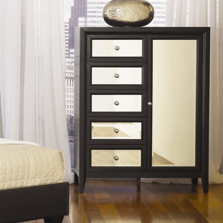 The gentlemen's chest is a configuration wherein the drawer column is paired with a large vertically oriented cabinet door. This holds a large cavity where hung suits, pants, and other clothing may be stored. The gentlemen's chest is a configuration wherein the drawer column is paired with a large vertically oriented cabinet door. This holds a large cavity where hung suits, pants, and other clothing may be stored.