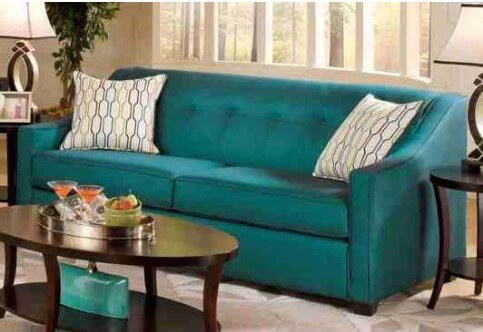 This more contemporary example is in a bright peacock blue. The backrest is one solid cushion with button-tufting. A higher backrest allows you to simply curl up in the corner. This more contemporary example is in a bright peacock blue. The backrest is one solid cushion with button-tufting. A higher backrest allows you to simply curl up in the corner.