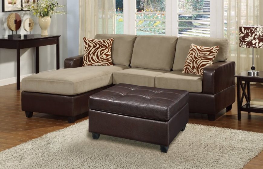 This contemporary three-piece sectional sofa has plush reversible microfiber cushions in a beige/gray color and comes with two zebra accent pillows and a faux leather cocktail ottoman. The chaise can be switched from the left to the right side. This contemporary three-piece sectional sofa has plush reversible microfiber cushions in a beige/gray color and comes with two zebra accent pillows and a faux leather cocktail ottoman. The chaise can be switched from the left to the right side.
