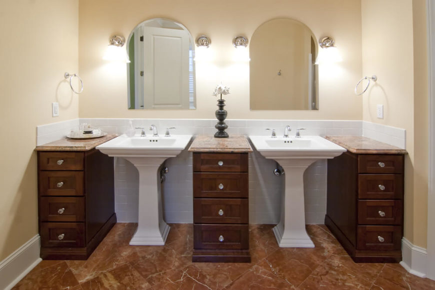 Bathroom with pedestal sinks and free-standing vanities. Bathroom with pedestal sinks and free-standing vanities.