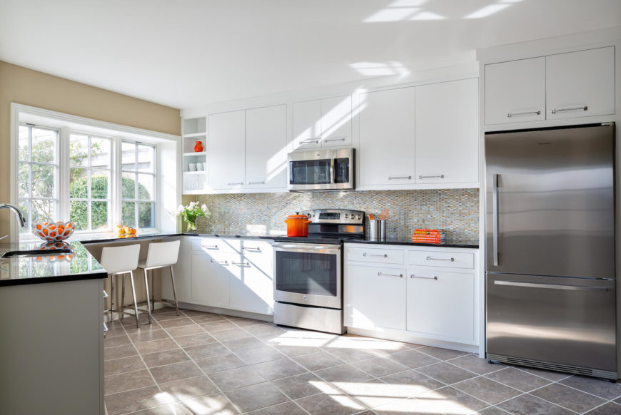 Beautiful triangle contemporary kitchen with high end appliances.