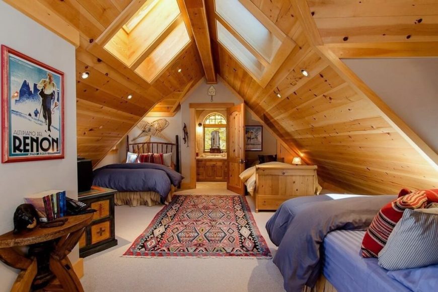 A three bed bunkroom with an adjoining bathroom on the far side of the attic. A three bed bunkroom with an adjoining bathroom on the far side of the attic.