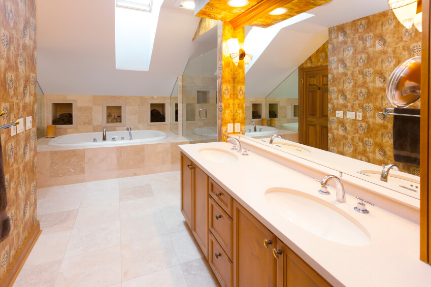 This brightly patterned bathroom is made all the more bright by carefully placed lighting fixtures and a stunning skylight. This brightly patterned bathroom is made all the more bright by carefully placed lighting fixtures and a stunning skylight.