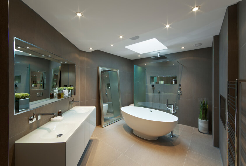This relaxing space offers the best of modern design and optimal comfort. The deep oblong porcelain bathtub sits below a soft skylight and bursts of recessed lighting, allowing for optimal relaxation and serenity. A fully glass enclosed shower blends into its surroundings, while the double vanity offers plenty of room for daily rituals. This relaxing space offers the best of modern design and optimal comfort. The deep oblong porcelain bathtub sits below a soft skylight and bursts of recessed lighting, allowing for optimal relaxation and serenity. A fully glass enclosed shower blends into its surroundings, while the double vanity offers plenty of room for daily rituals.