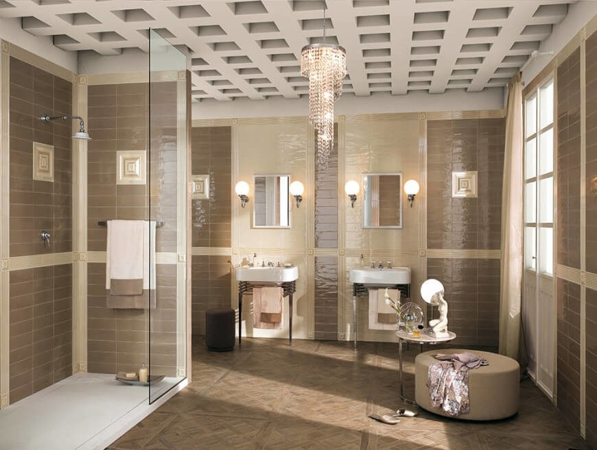 A delicate chandelier hangs from this ceiling for a truly classy look. The taupe color scheme is highlighted by the natural light filtering through a large colonial window. A delicate chandelier hangs from this ceiling for a truly classy look. The taupe color scheme is highlighted by the natural light filtering through a large colonial window.