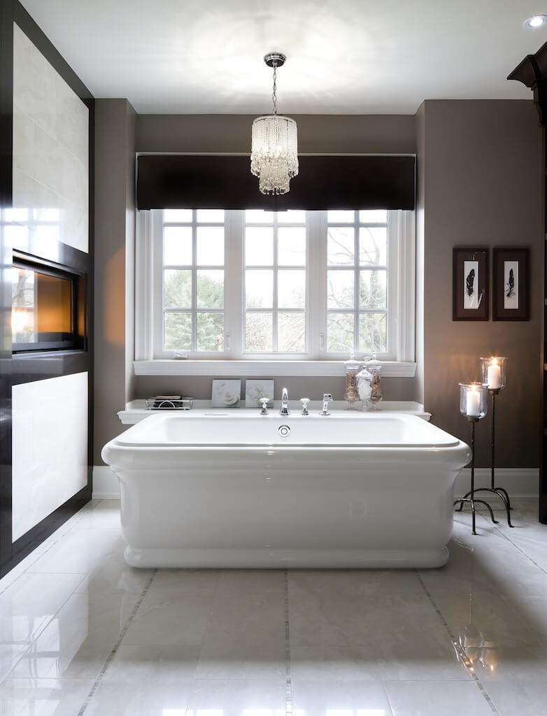 The same room has a very large bathtub with a shelving unit beside it for storage. A small crystal light fixture and candles give this room a very peaceful atmosphere. The same room has a very large bathtub with a shelving unit beside it for storage. A small crystal light fixture and candles give this room a very peaceful atmosphere.