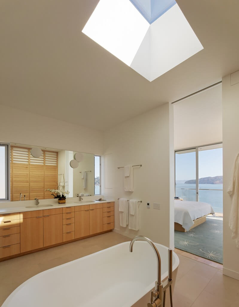 This space using a lot of light toned natural wood. The bathroom is connected directly to the bedroom and has a large skylight for plenty of natural light. This space using a lot of light toned natural wood. The bathroom is connected directly to the bedroom and has a large skylight for plenty of natural light.