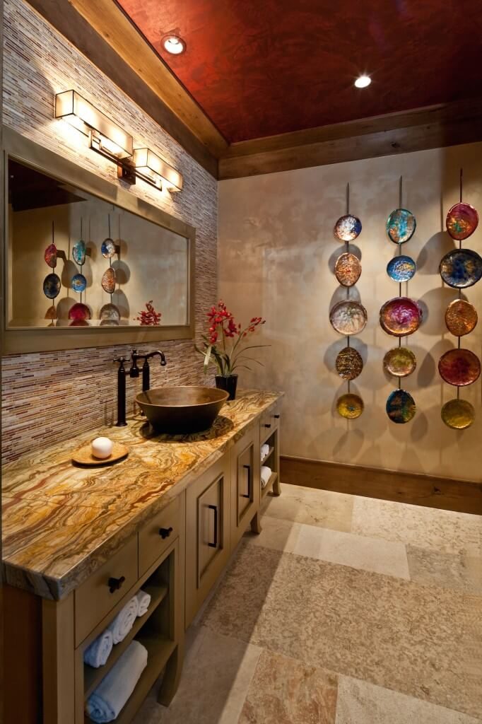 This incredible room has a lot of unique colors and patterns. Three rows of hanging wall art are a bold and beautiful addition to this room. This incredible room has a lot of unique colors and patterns. Three rows of hanging wall art are a bold and beautiful addition to this room.