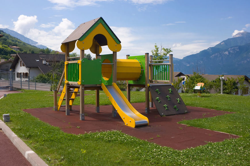 This green and yellow playset includes a slide, climbing wall, and a tunnel to crawl through. This green and yellow playset includes a slide, climbing wall, and a tunnel to crawl through.