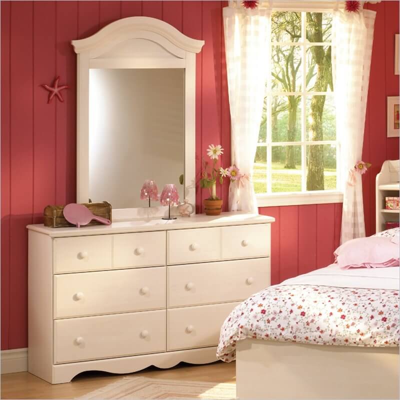 Shown in a little girl's room, a simple chair could transform this into a dresser that pulls double-duty as a makeup table. The small drawers at the top are perfect for holding small implements. Shown in a little girl's room, a simple chair could transform this into a dresser that pulls double-duty as a makeup table. The small drawers at the top are perfect for holding small implements.