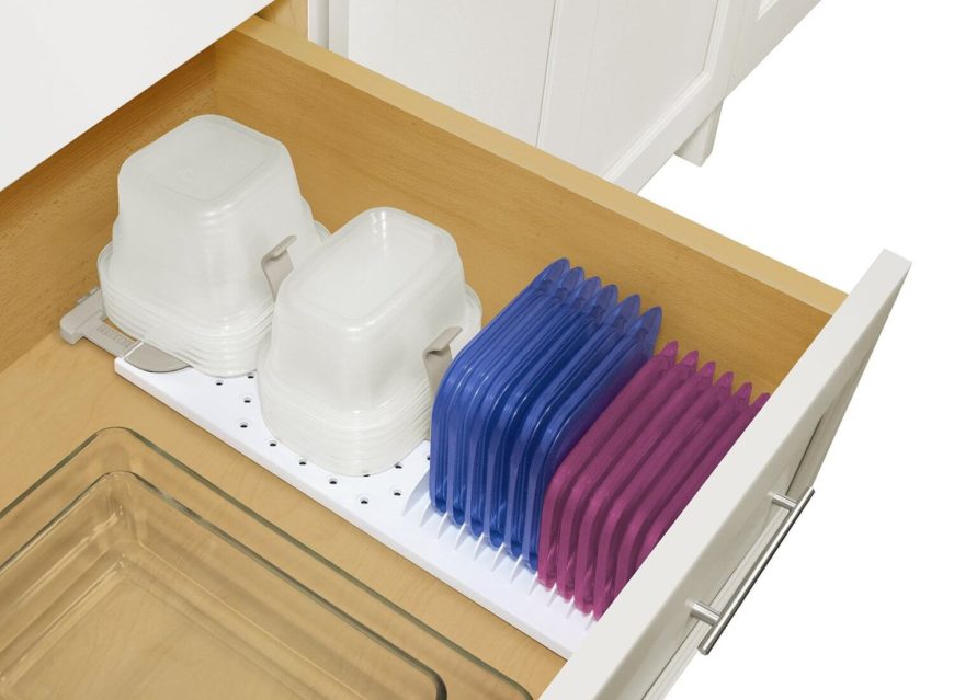 This clever solution has grips to hold your bowls in place, and a spot right next to it to hold the lids. This clever solution has grips to hold your bowls in place, and a spot right next to it to hold the lids.