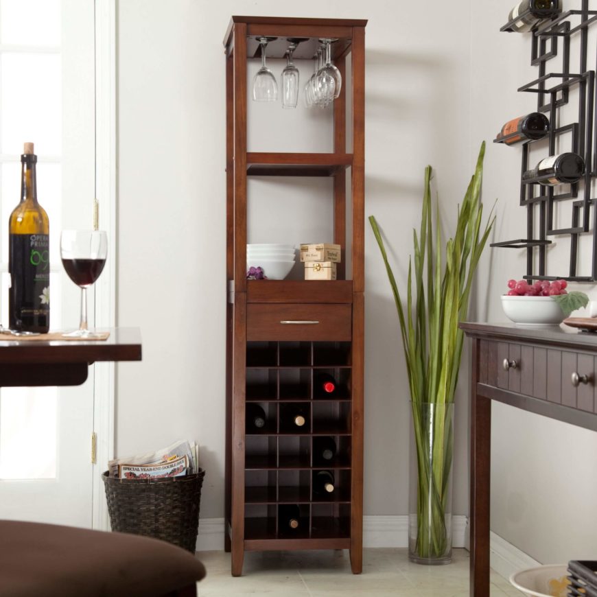 This wine tower can hold up to 18 bottles of wine, and has several shelves above to house wine glasses and decorative accents. This wine tower can hold up to 18 bottles of wine, and has several shelves above to house wine glasses and decorative accents.